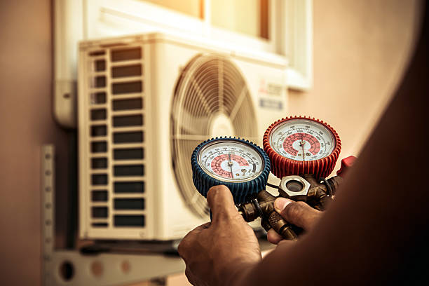 Professional Heat Pump Repair technician working in Central City, IA